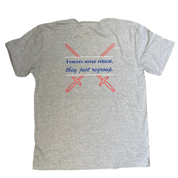 The blue words, "Fencers never retreat, they just regroup." are bordered by bright white lines, and two crisp, red sword outlines, crisscross behind, adding a patriotic touch. Adult heathered grey shirt.