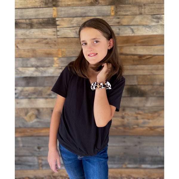 Light leopard on white semi-matte scrunchie on wrist