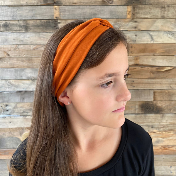 ginger rust matte faux knot headband on head side view Pipevine designs 