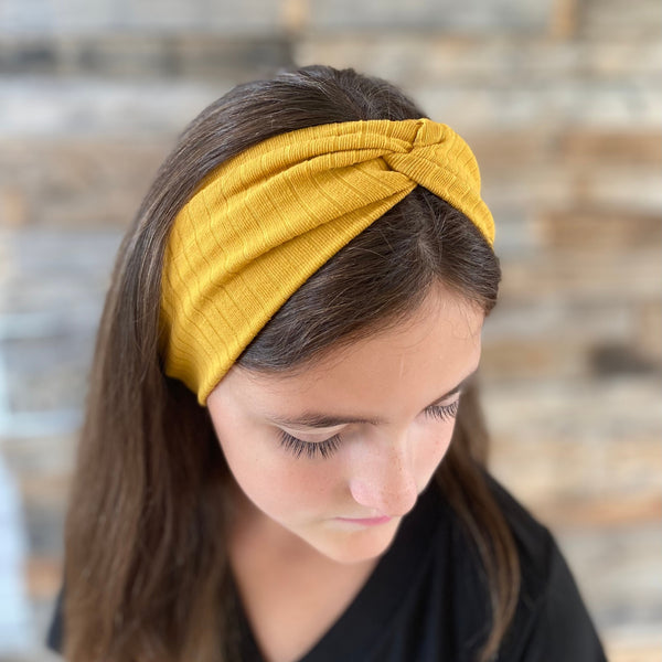 Mustard ribbed faux knot headband ear warmer on head ear warmer view Pipevine Designs