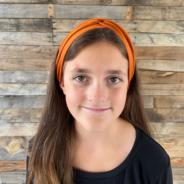 ginger rust matte faux knot headband on head front view Pipevine designs