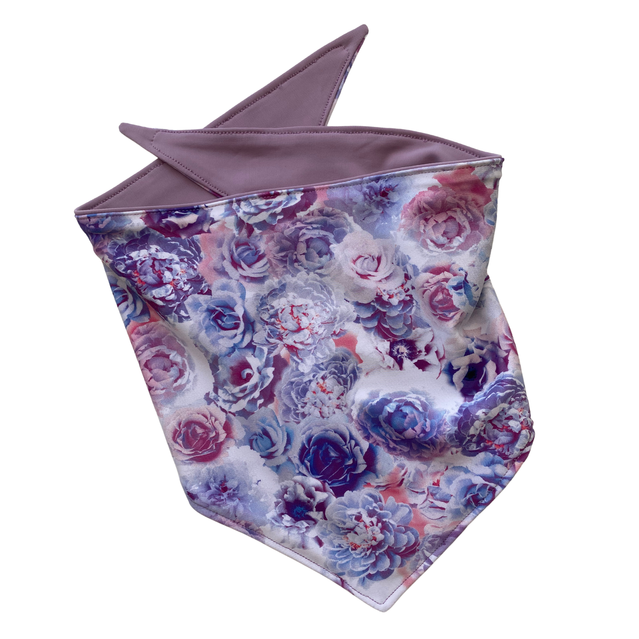 A close-up view of a Reversible Lavender and Pastel Rose Print Dog Swim scARF. The scARF features a soft lavender side on one half and a charming pastel rose print on the other half.