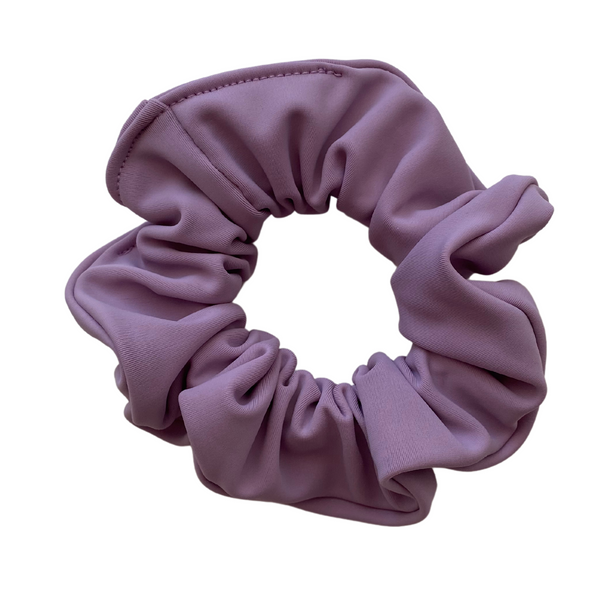 Close up picture of solid lavender swim scrunchie. Pipevine Designs.