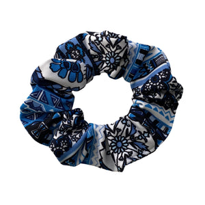 Blue geometric floral on white, semi-shiny scrunchie