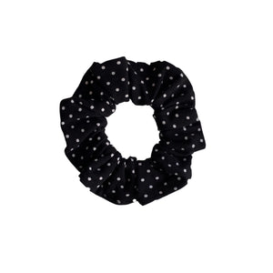 small white polka dots on black scrunchie