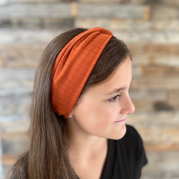 Rust Burnt Orange ribbed faux knot headband ear warmer on head side ear warmer view pipevine designs 