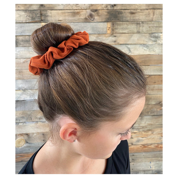 Rust ribbed scrunchie on head Pipevine Designs 