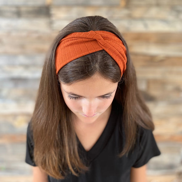 Rust Burnt Orange ribbed faux knot headband ear warmer on head top knot view pipevine designs 