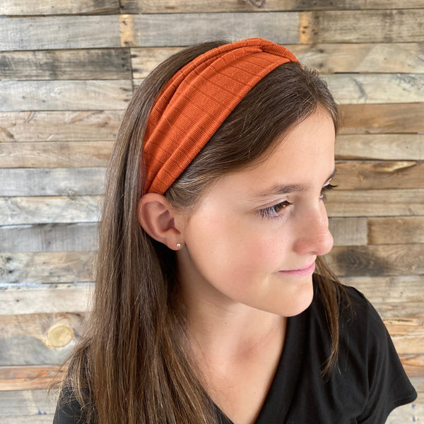 Rust Burnt Orange ribbed faux knot headband ear warmer on head side headband view pipevine designs 